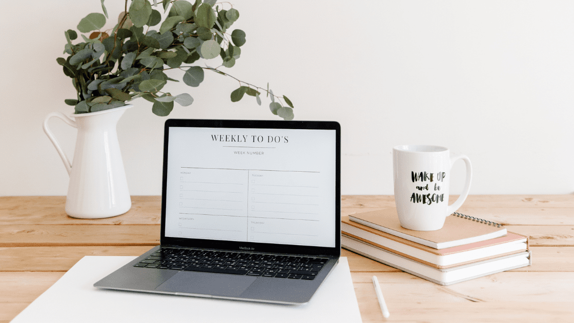 Desk space with laptop and weekly to do list planner on social media content ideas for health practitioners