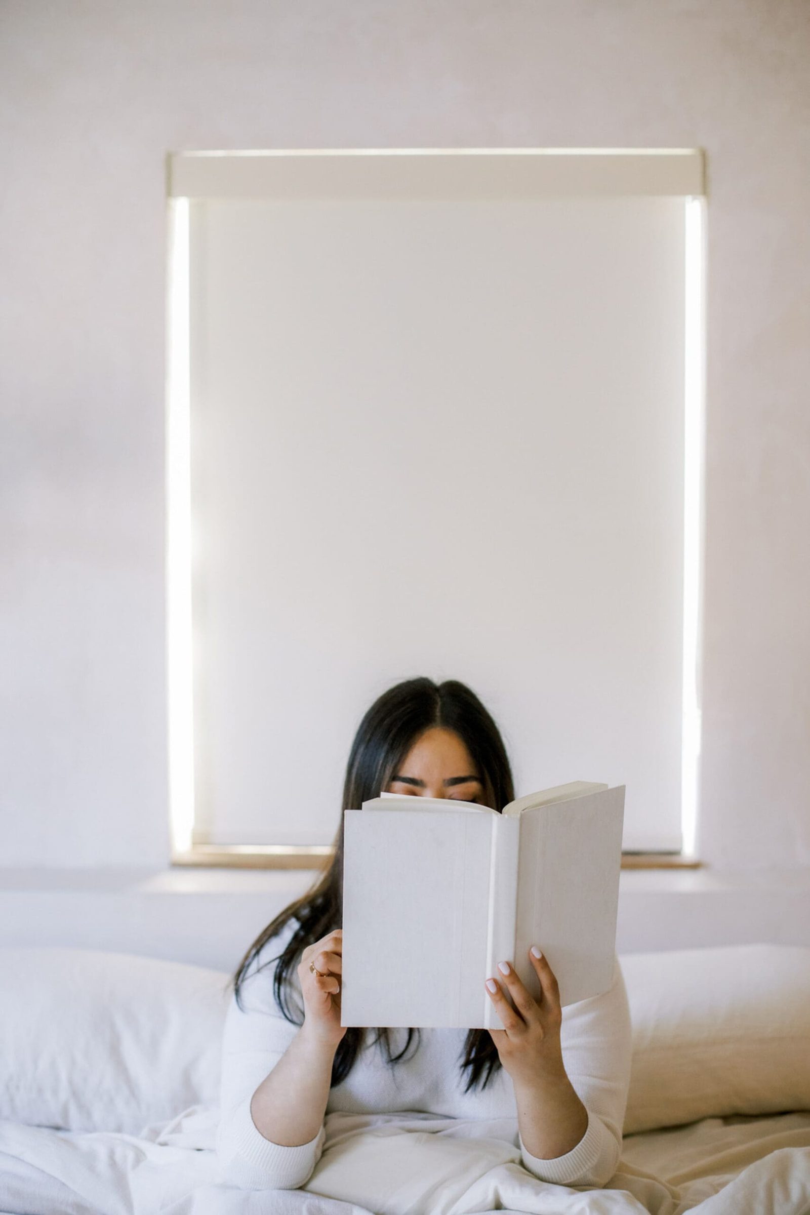 a health practitioner reading a book with tips on brand archetypes for entrepreneurs