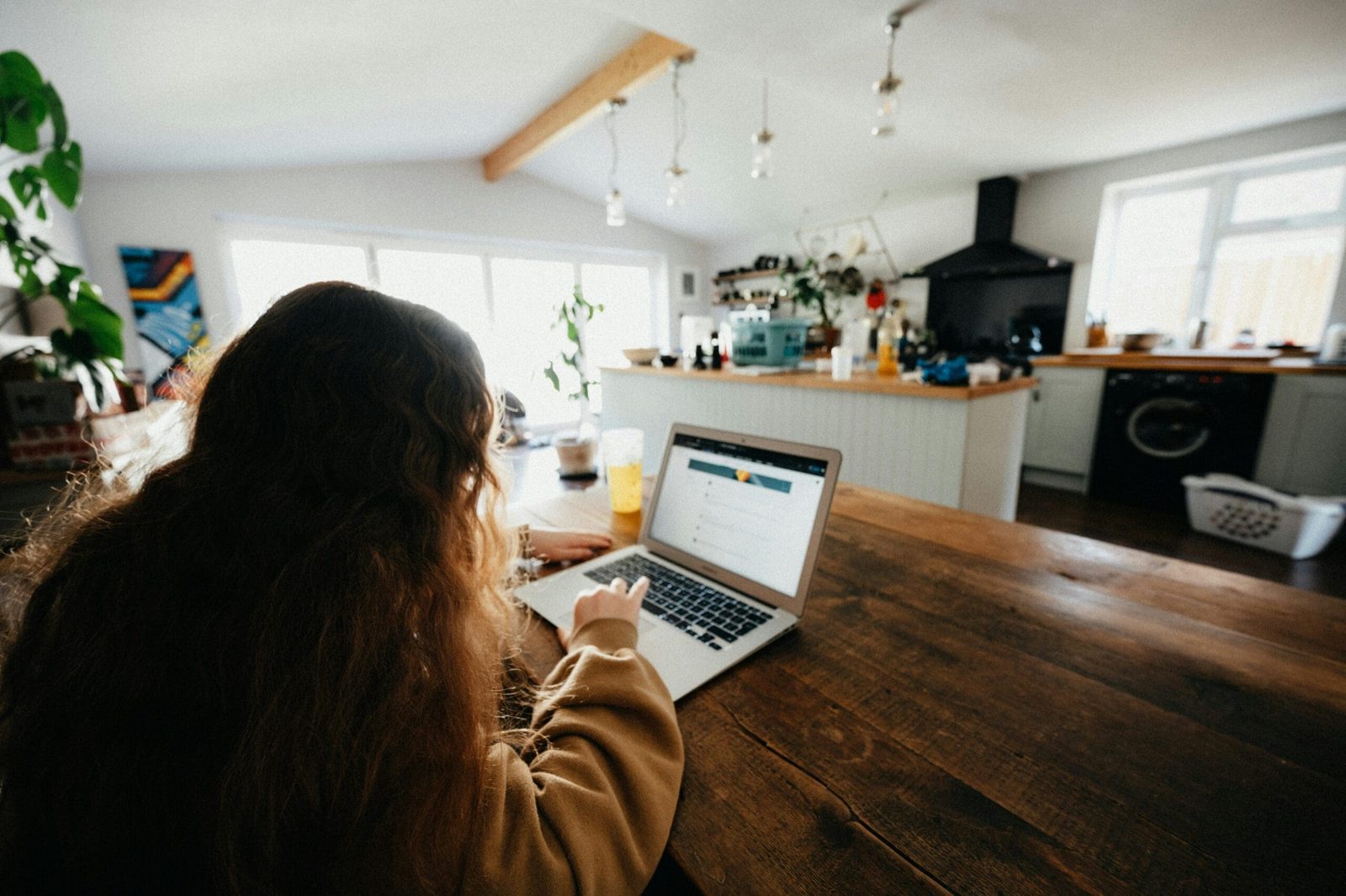 Female practitioner studying lab results on laptop