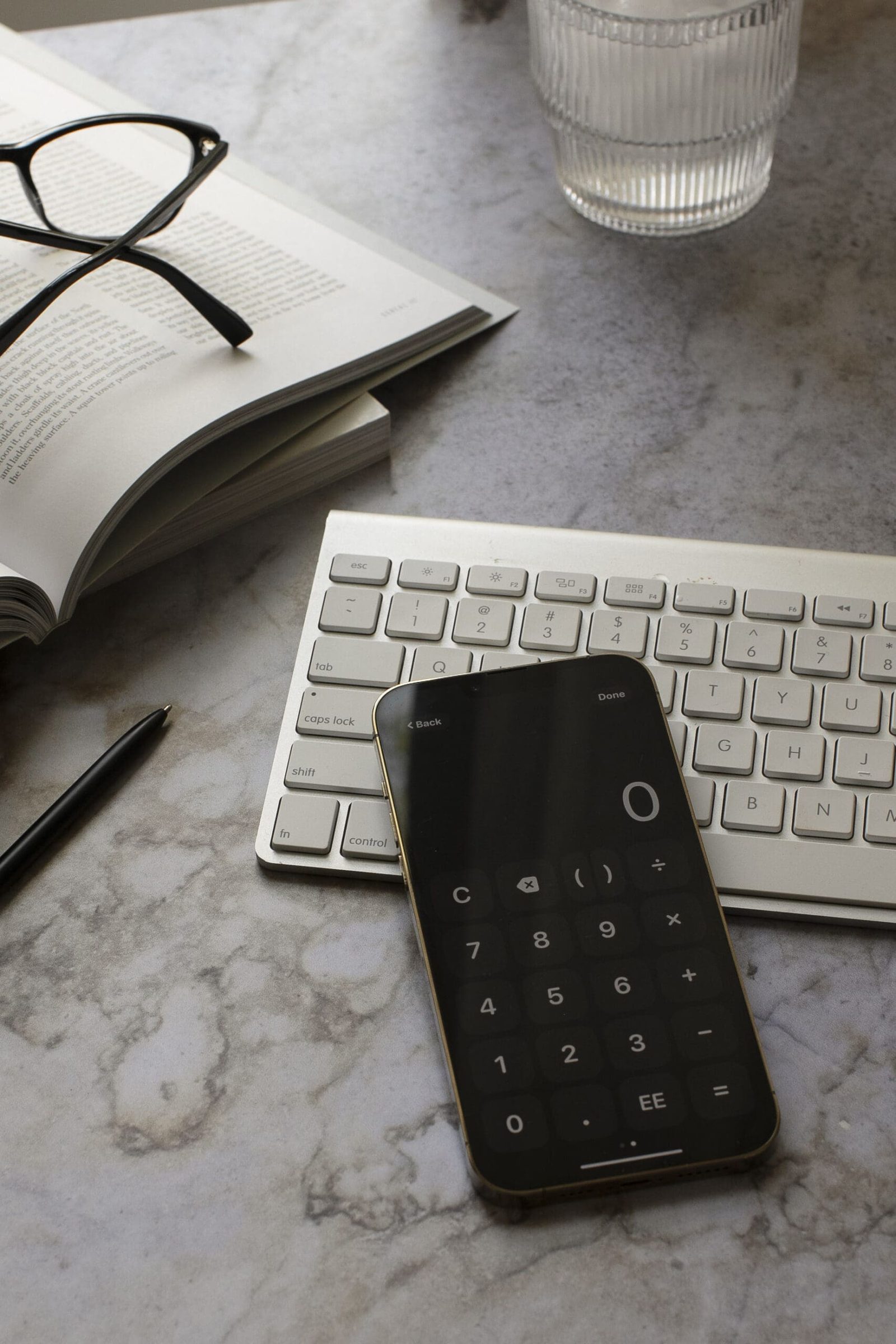 A minimalist desk setup showing tools often used in functional medicine for physical therapists.