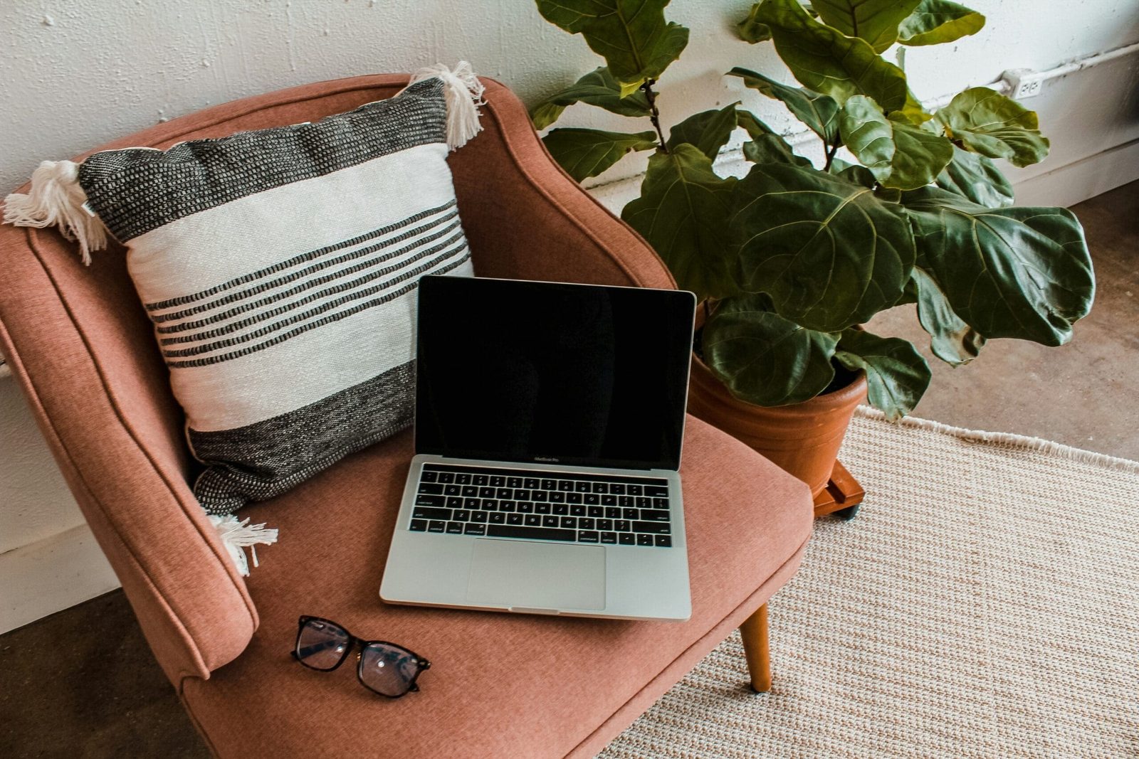 Cozy home office setup with laptop – representing the freedom of running an online health practice.