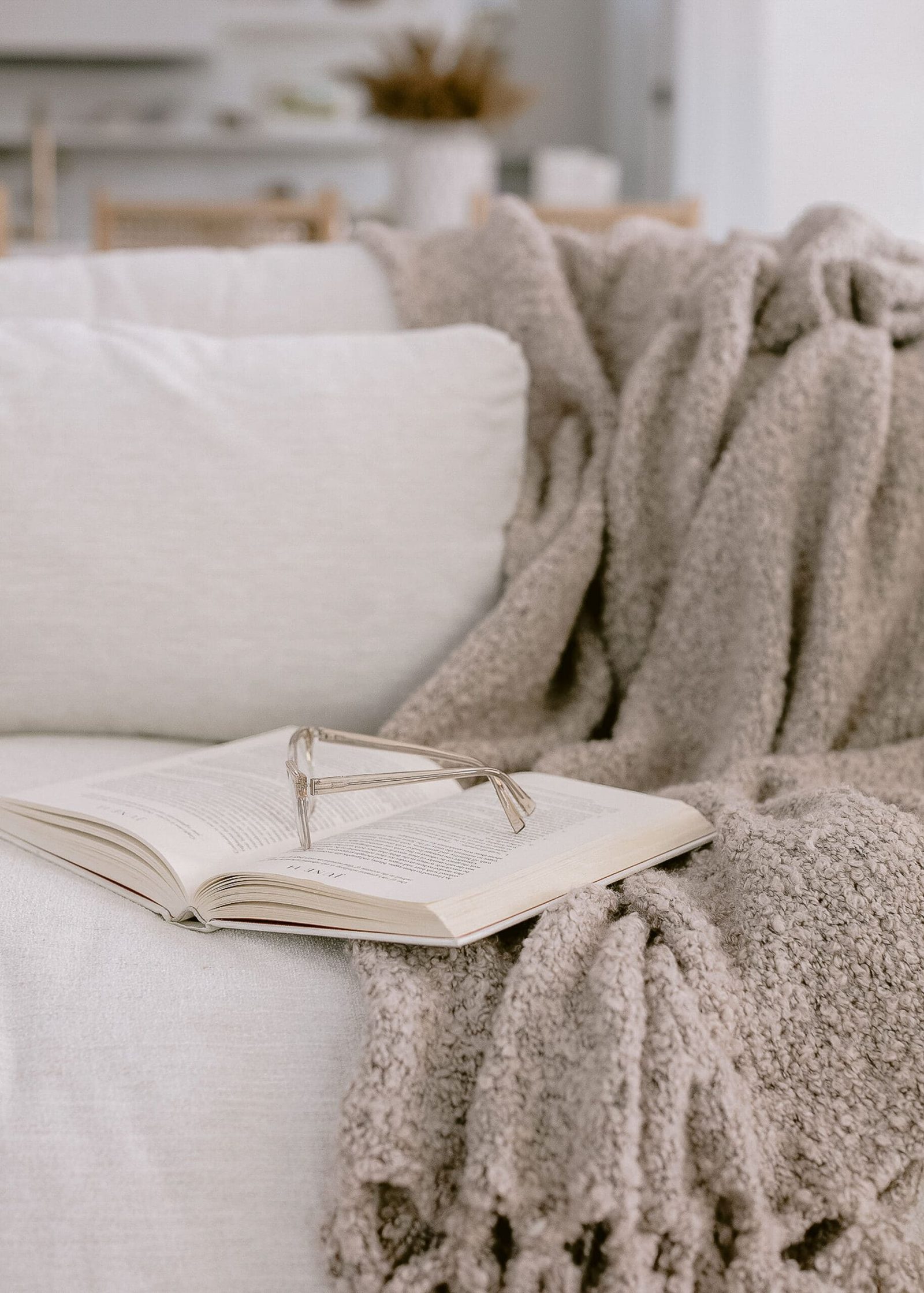 open book on the couch to learn about mindset for online health practitioners