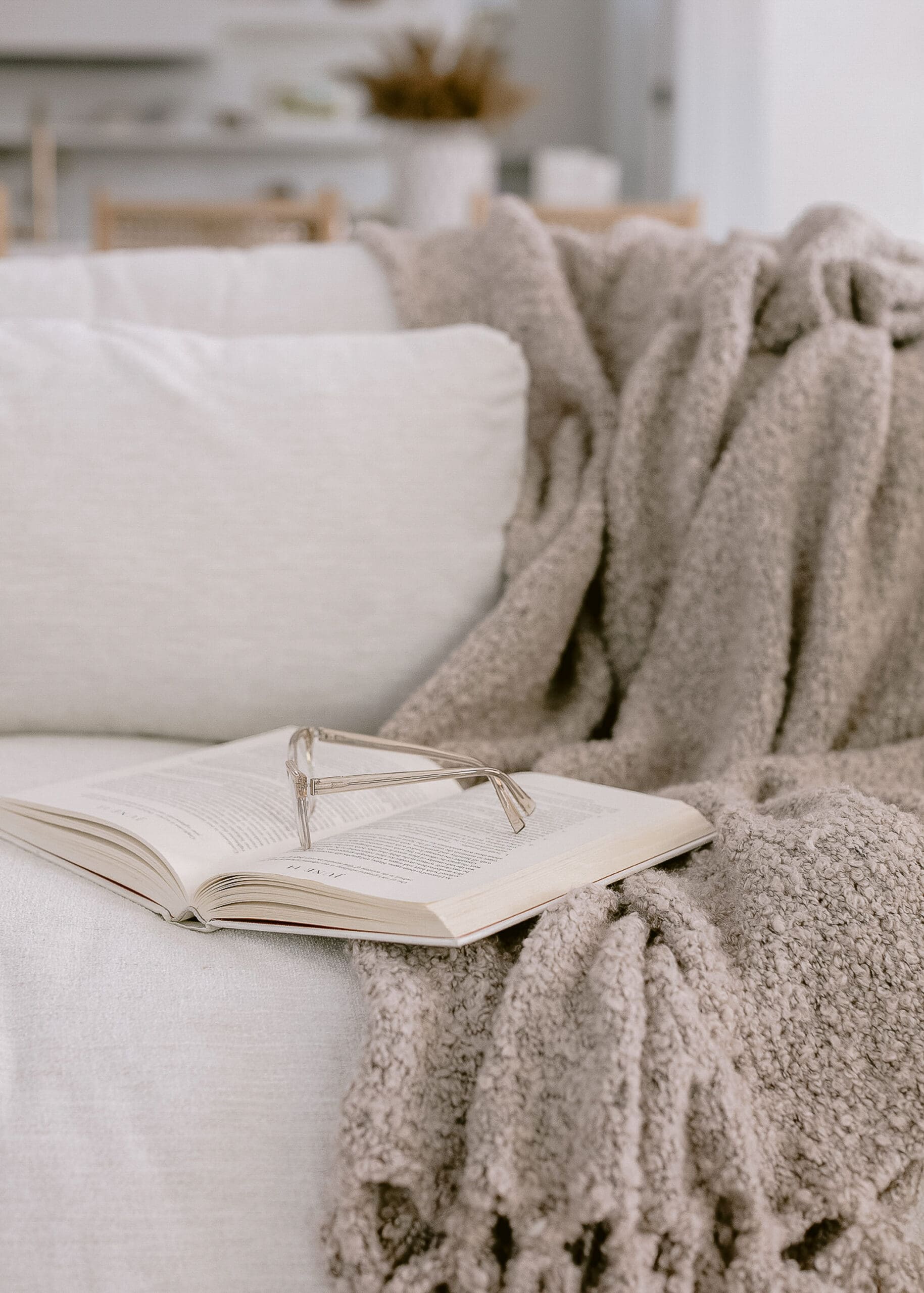 open book on the couch to learn about mindset for online health practitioners