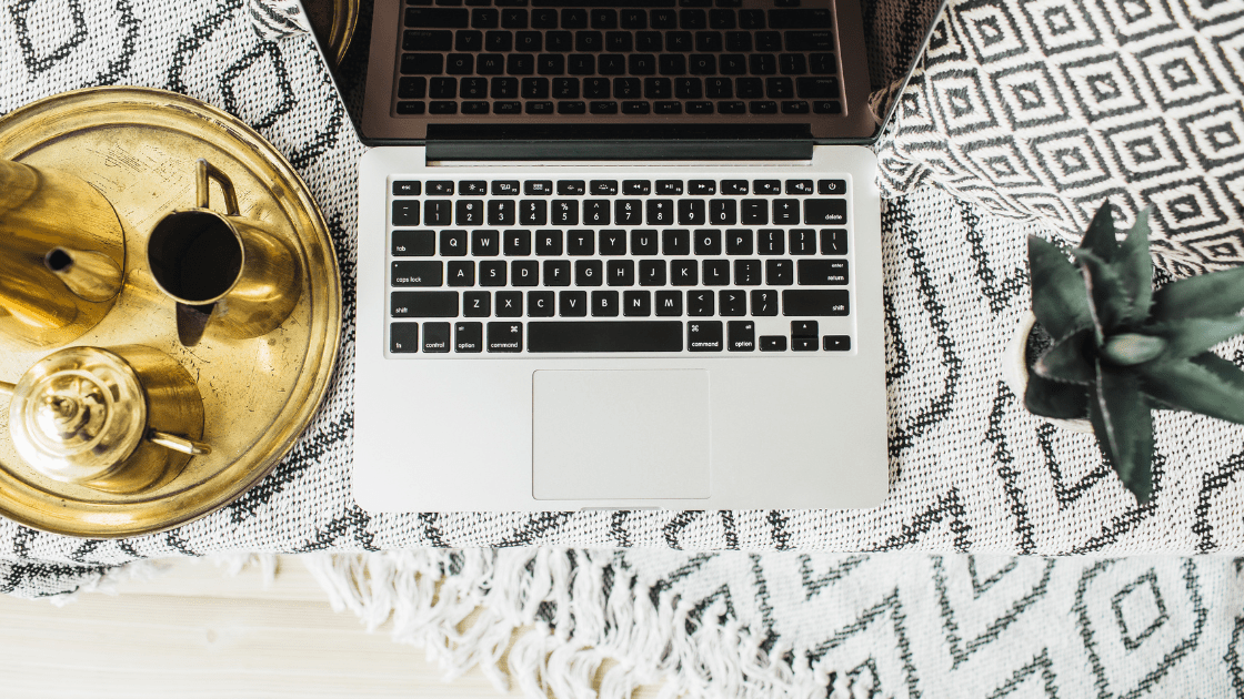 Boho work setup for learning how to build a profitable health coaching business