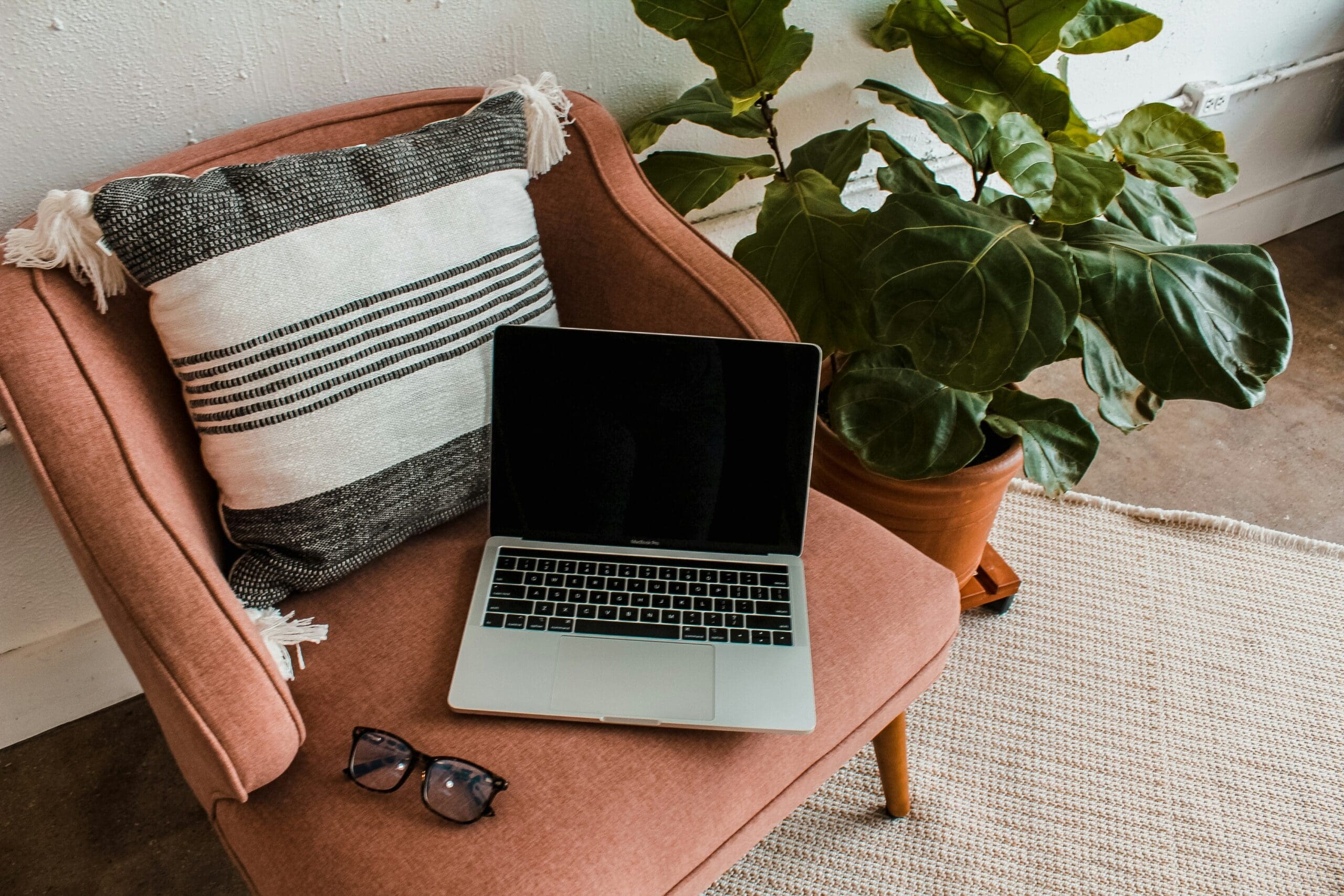 Cozy home office setup with laptop – representing the freedom of running an online health practice.