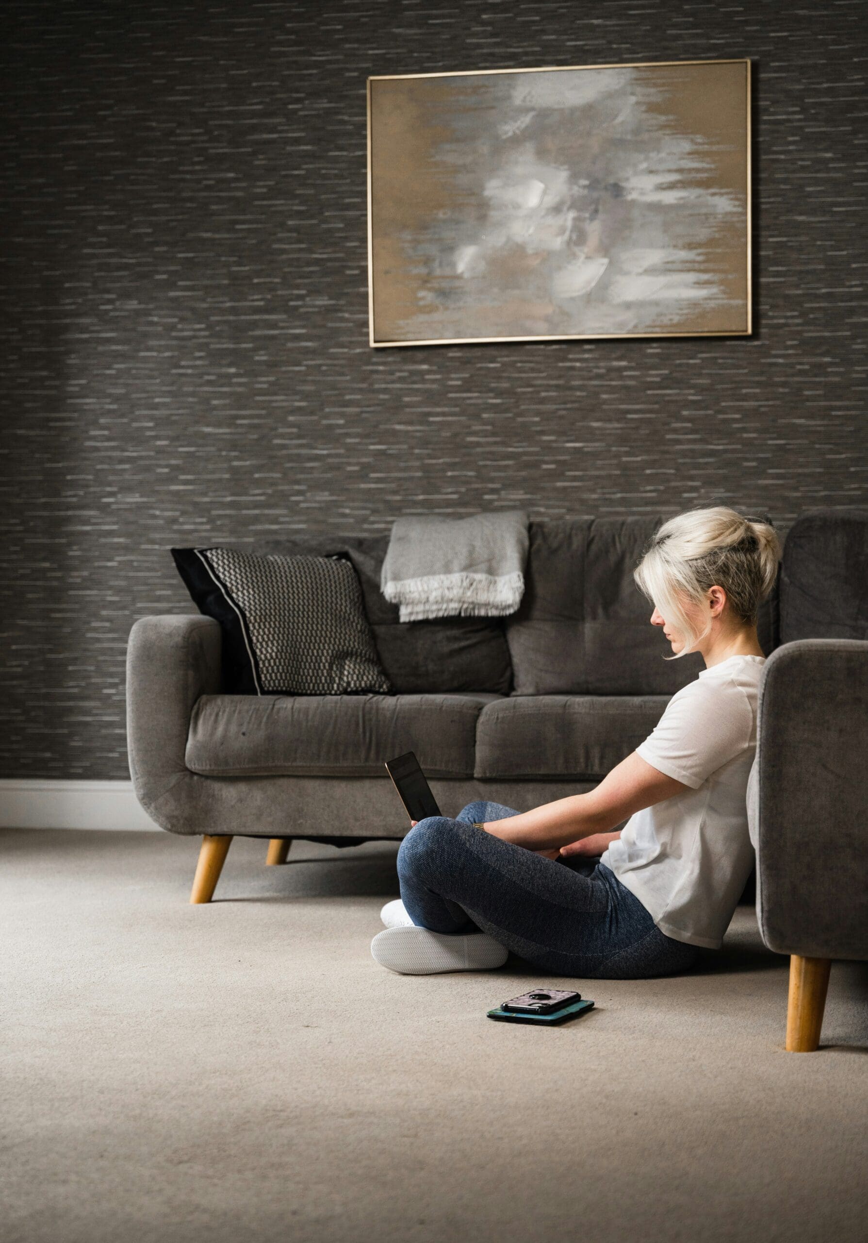 Nurse practitioner working remotely from home on her laptop, transitioning from hospital burnout to a thriving virtual health practice.