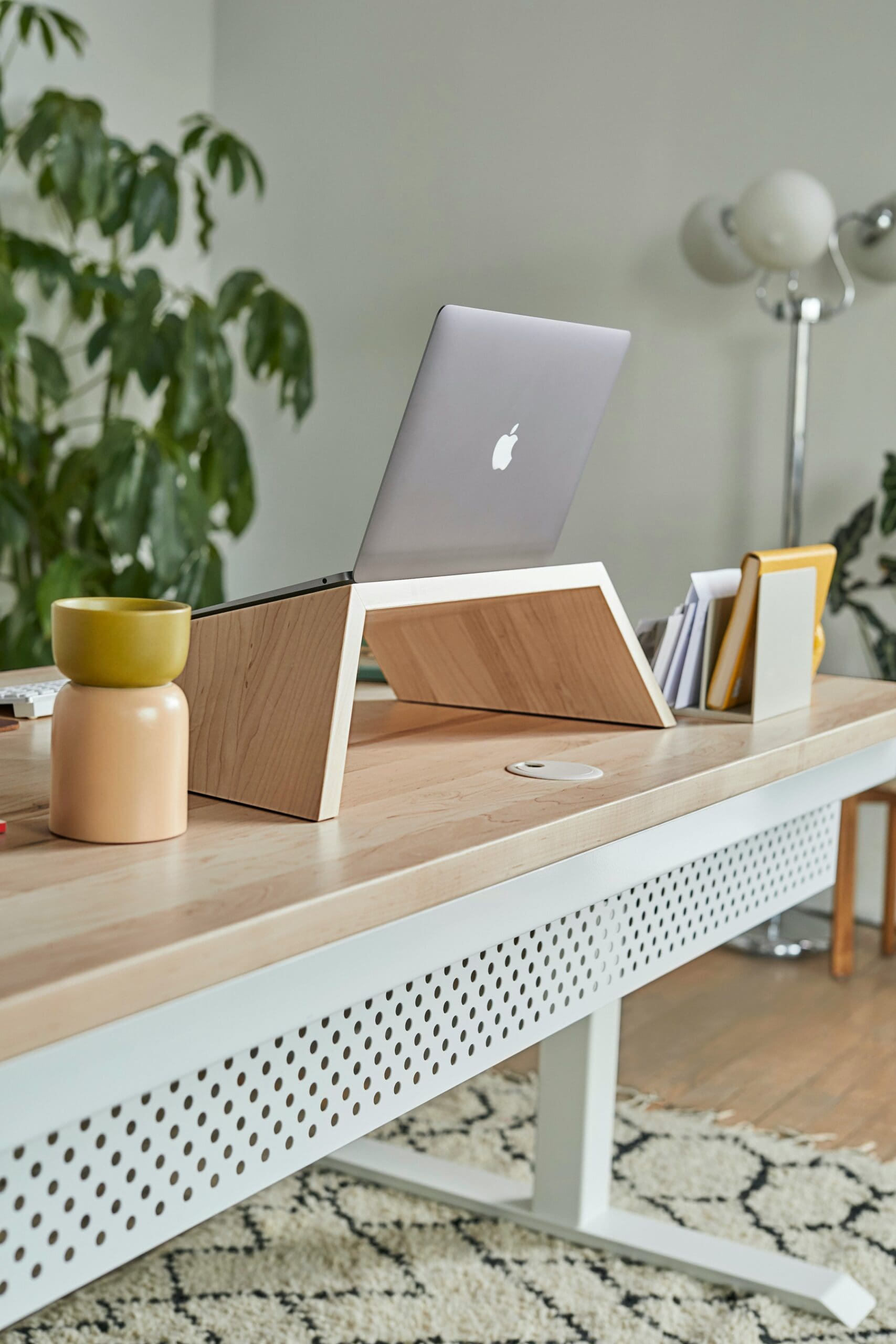 Laptop on a desk with marketing notes for building an online health practice.