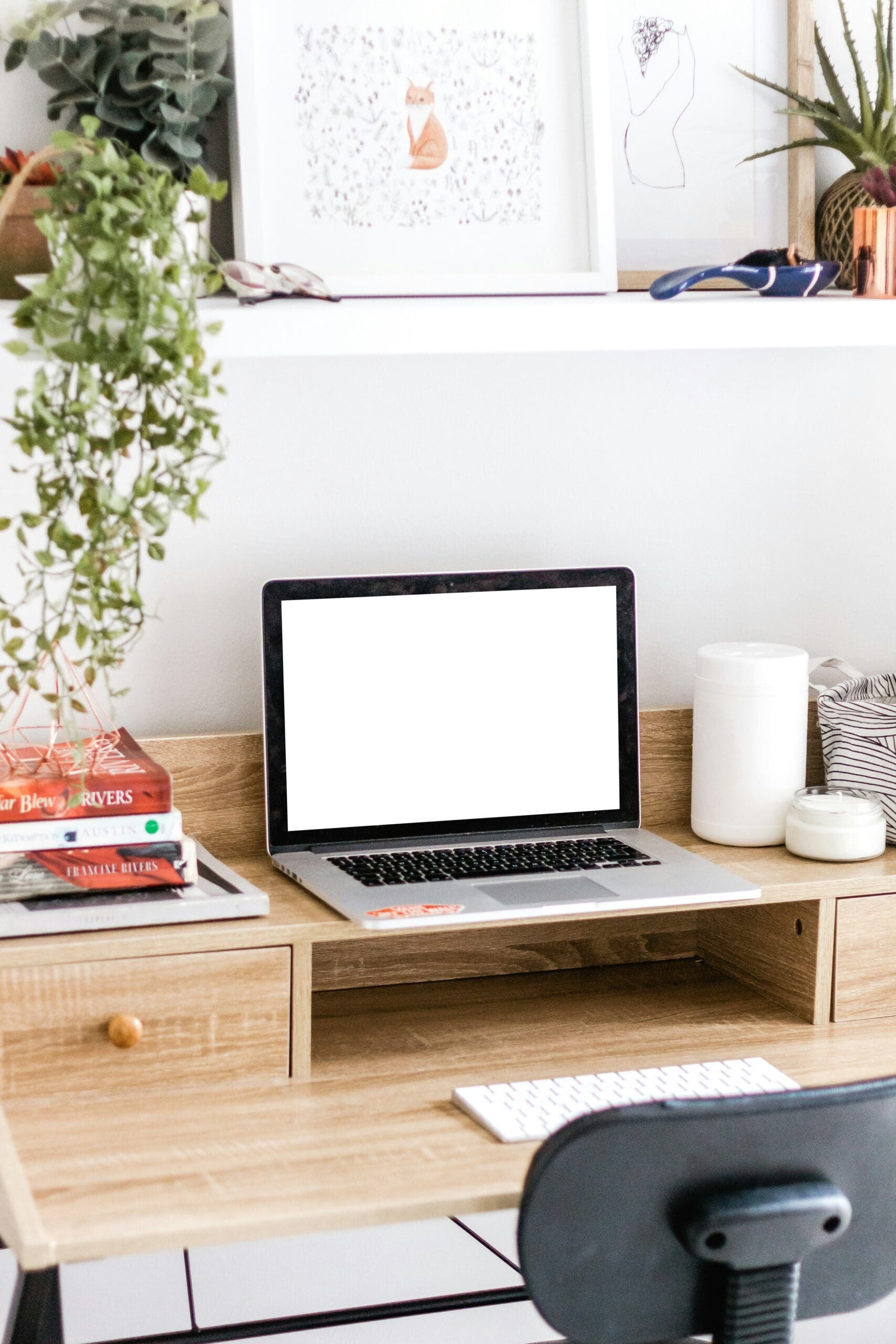 Laptop setup used by a naturopath to run her virtual health programs.