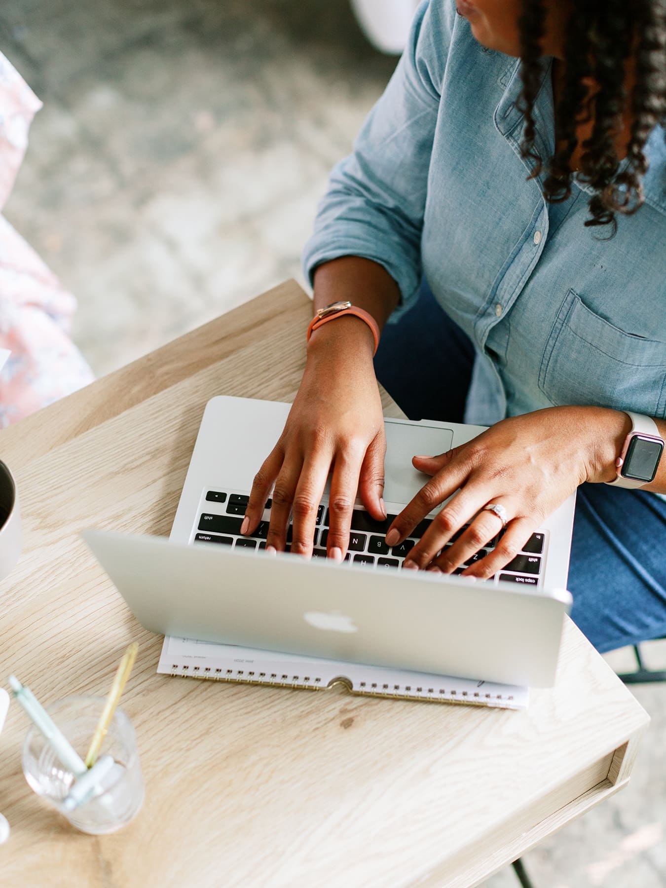 a health practitioner working on her laptop at a desk searching how to move your private practice online